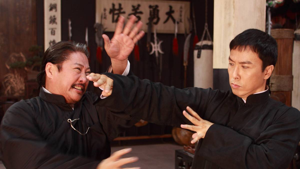 A screenshot from Ip Man 2, showing Donnie Yen engaged in a fight with Sammo Hung.
