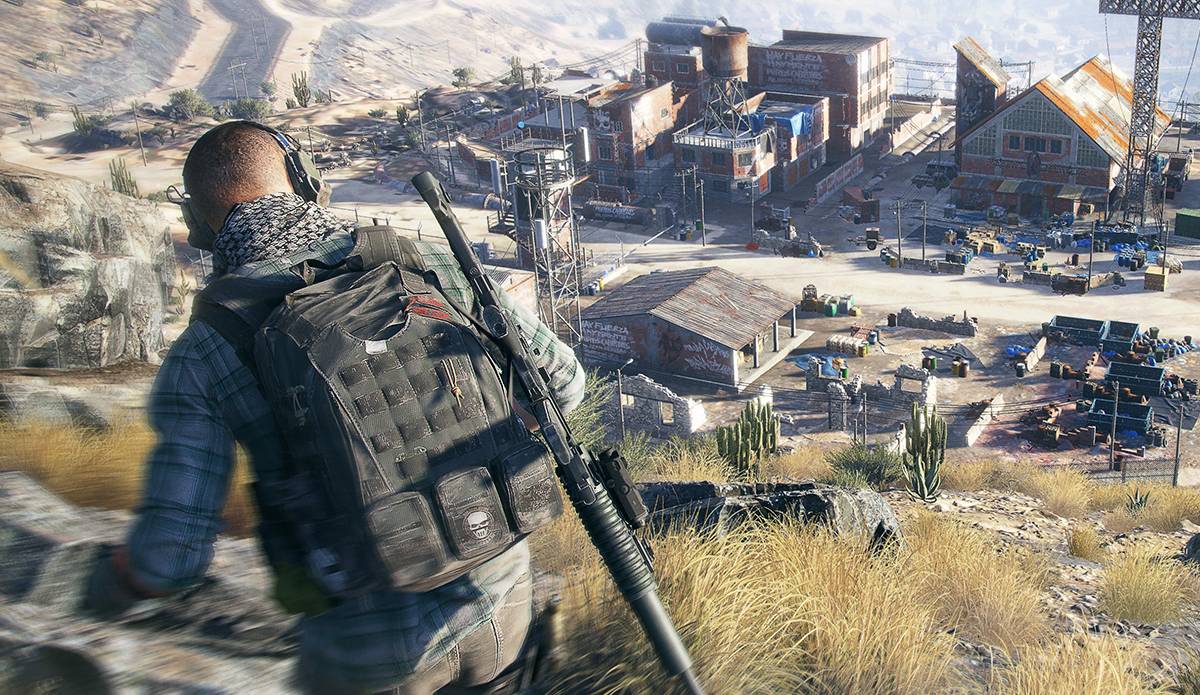 A Wildlands screenshot showing a character stood on a hill, overlooking a village