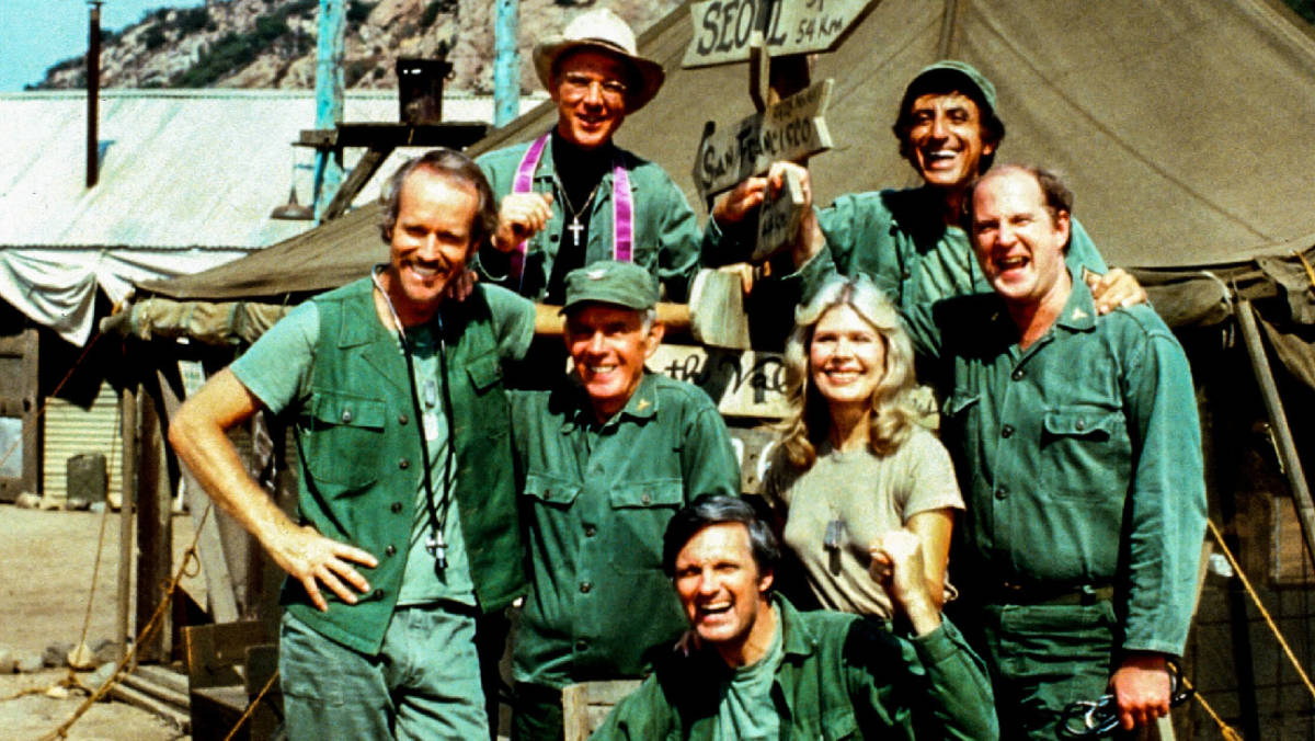 M*A*S*H (CBS) 1977-1983 Shown: clockwise from bottom, Alan Alda (as Capt. Benjamin Franklin "Hawkeye" Pierce), Harry Morgan (as Col. Sherman T. Potter), Mike Farrell (as Captain BJ Hunnicut), William Christopher (as Father John Patrick Francis Mulcahy), Jamie Farr (as Corporal/Sergeant Maxwell Q. Klinger), David Ogden Stiers (as Charles Emerson Winchester III), Loretta Swit (as Major Margaret J. "Hot Lips" Houlihan) decades