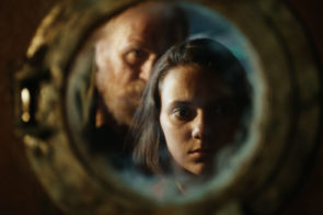 Programme Name: His Dark Materials - TX: n/a - Episode: The Spies (No. 3) - Picture Shows: Farder Coram (JAMES COSMO), Lyra Belacqua (DAFNE KEEN) - (C) Bad Wolf - Photographer: screen grab