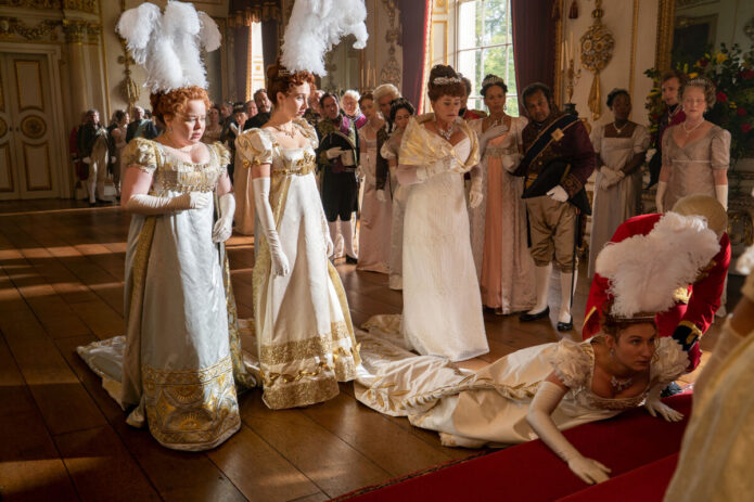 BRIDGERTON (L to R) NICOLA COUGHLAN as PENELOPE FEATHERINGTON, HARRIET CAINS as PHILLIPA FEATHERINGTON, BESSIE CARTER as PRUDENCE FEATHERINGTON and POLLY WALKER as PORTIA FEATHERINGTON in episode 101 of BRIDGERTON Cr. LIAM DANIEL/NETFLIX © 2020 december